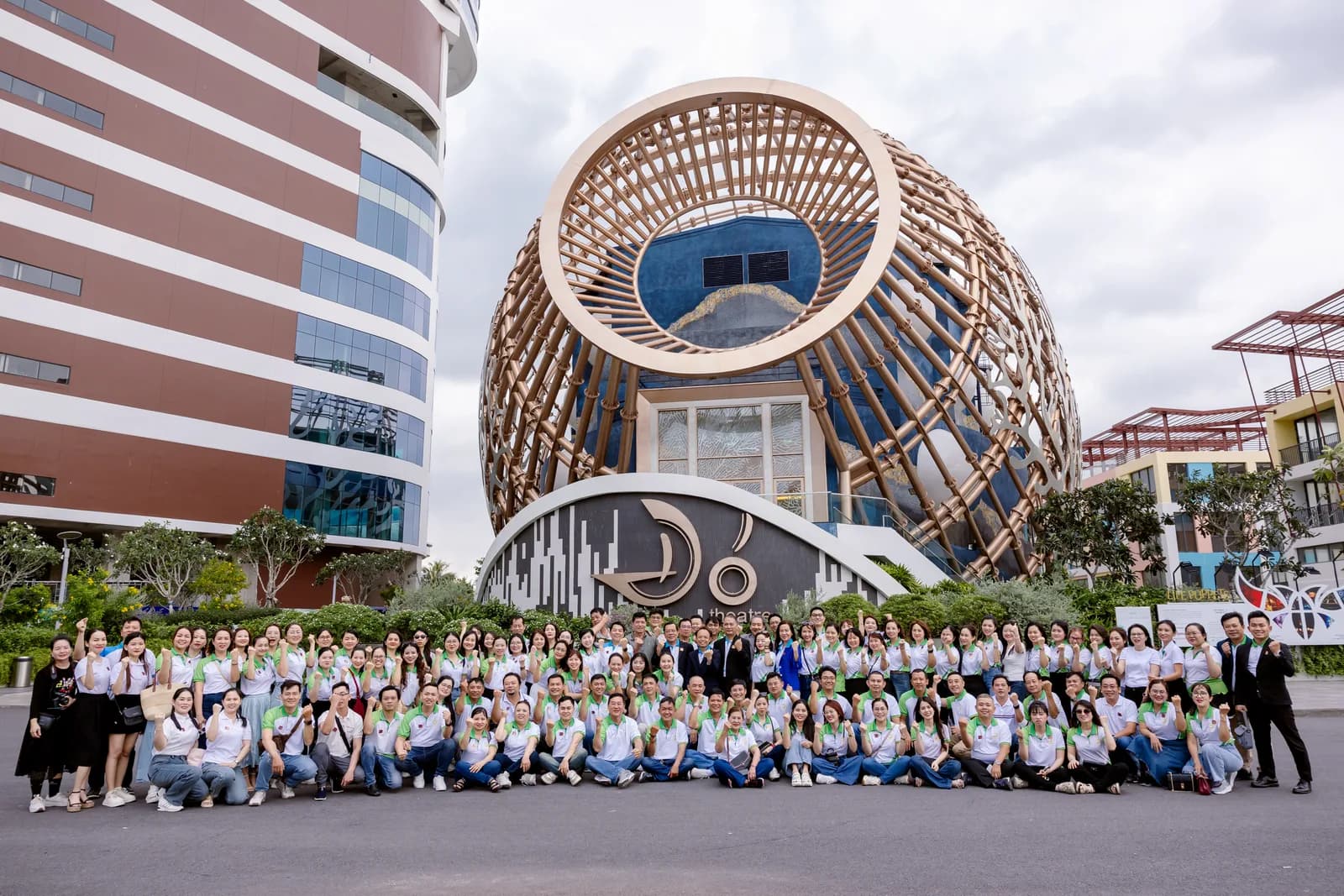 Richfield team portrait in front of the modern campus